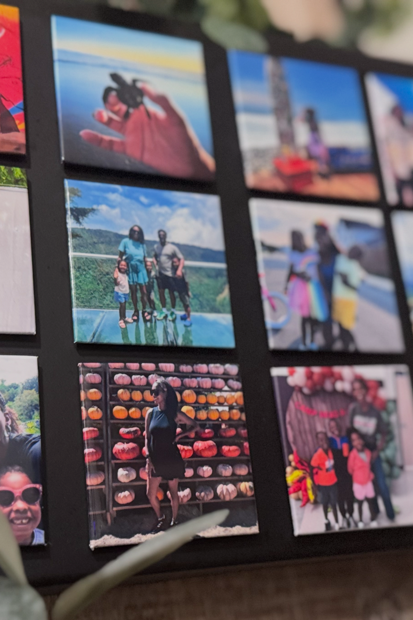 Wall with a decorative photo collage featuring various family photos.